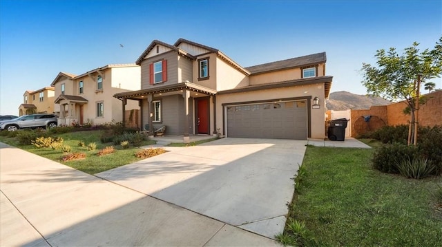 view of front of property with a garage and a front lawn