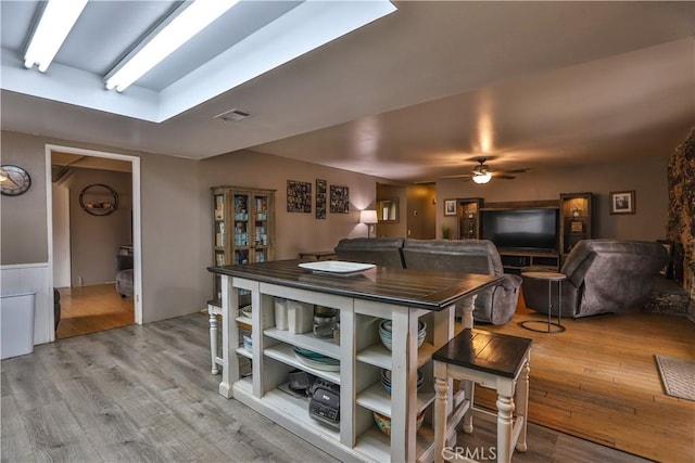 dining room featuring hardwood / wood-style floors and ceiling fan