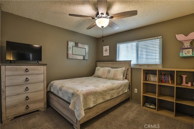 bedroom featuring a textured ceiling, ceiling fan, and dark carpet