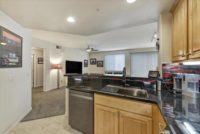 kitchen with ceiling fan, stainless steel dishwasher, light tile patterned flooring, and sink