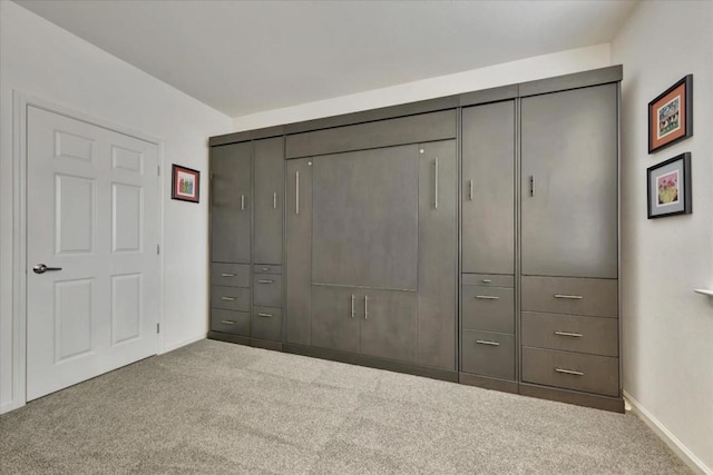 unfurnished bedroom featuring a closet and carpet