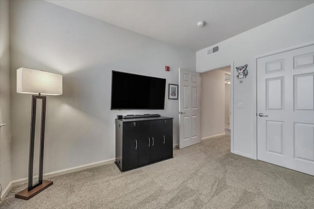 unfurnished living room with light carpet