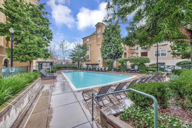 view of pool featuring a patio