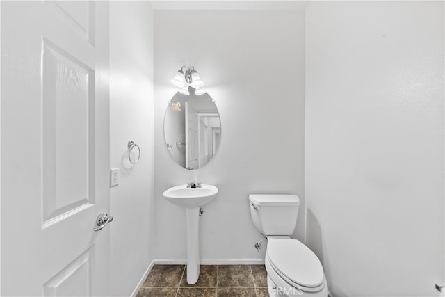 bathroom with sink and toilet