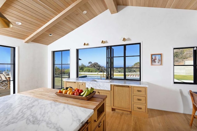 bedroom featuring sink, wood ceiling, high vaulted ceiling, light wood-type flooring, and beam ceiling