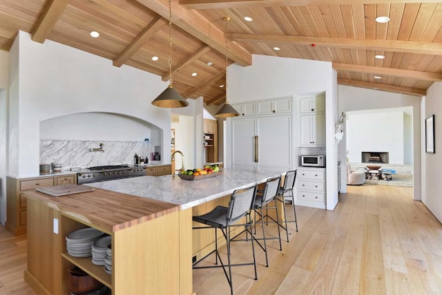 6260 Waverly Ave, La Jolla, CA 92037 - kitchen featuring backsplash, stainless steel range, a wood ceiling with exposed beams, wood counters, and light wood-style flooring
