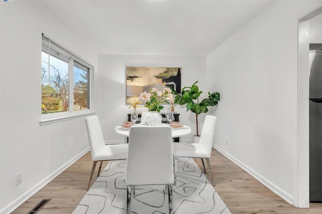 dining area with light wood-type flooring