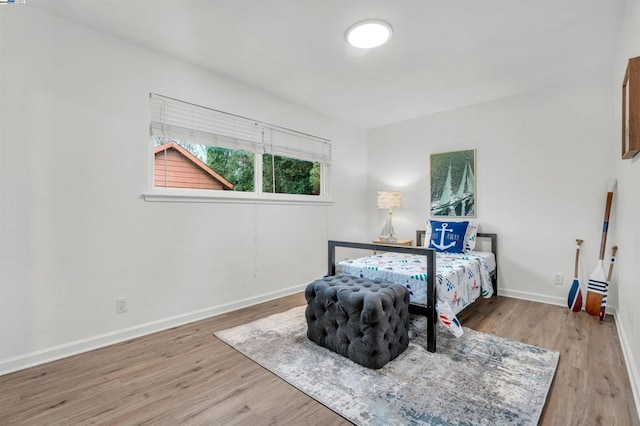 bedroom with light hardwood / wood-style flooring