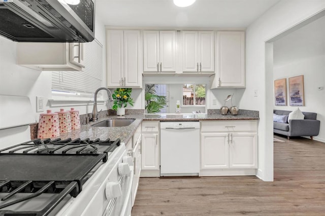 kitchen with sink, white appliances, white cabinetry, range hood, and light wood-type flooring