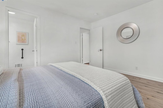 bedroom featuring hardwood / wood-style floors