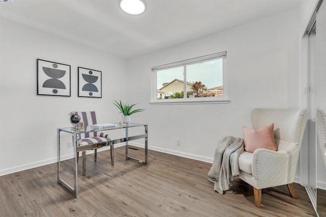 office space with wood-type flooring