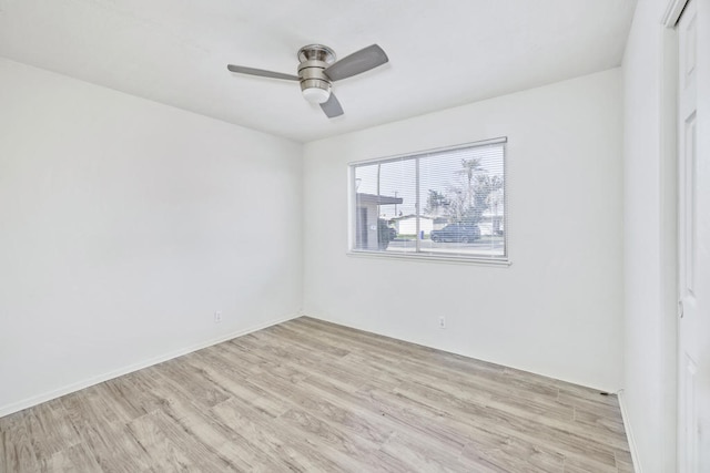 unfurnished room with light hardwood / wood-style flooring and ceiling fan