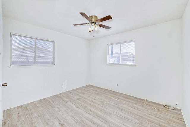 empty room featuring ceiling fan and light wood-type flooring