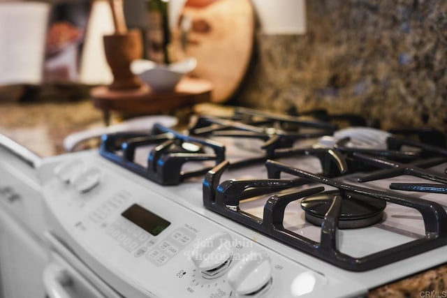 room details featuring white gas range