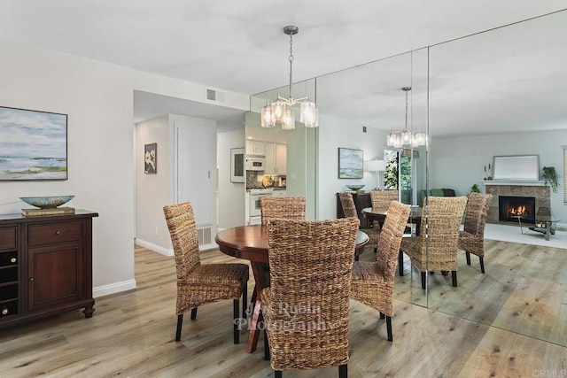 dining space featuring light hardwood / wood-style flooring