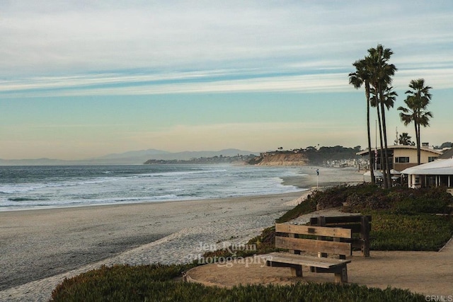 property view of water featuring a beach view