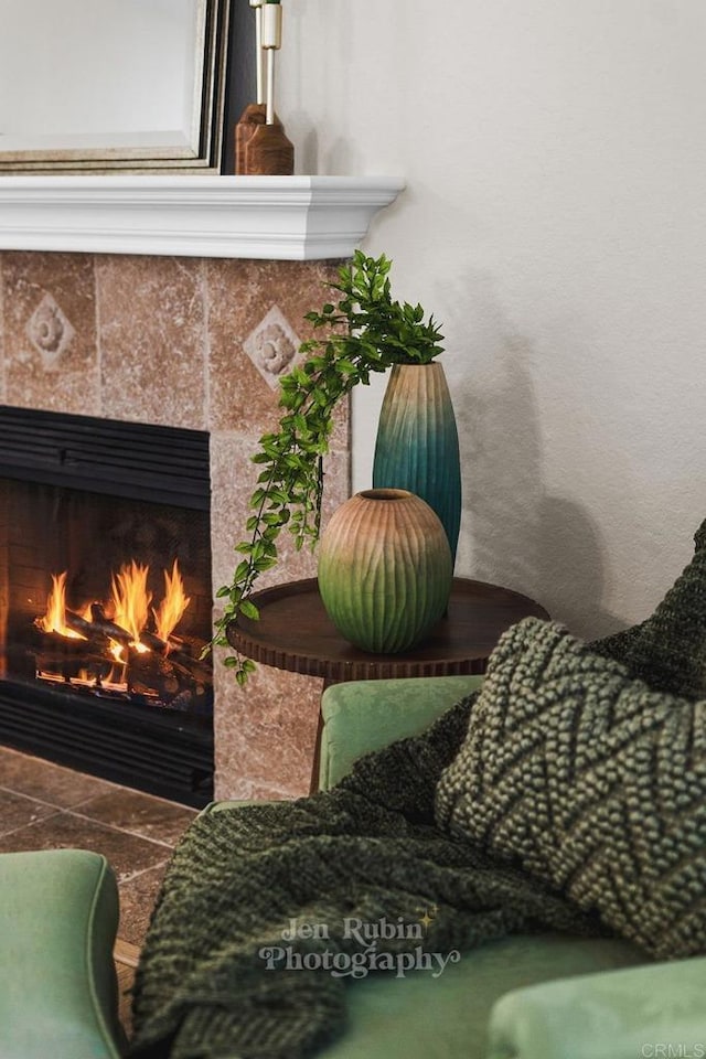 room details featuring a tile fireplace