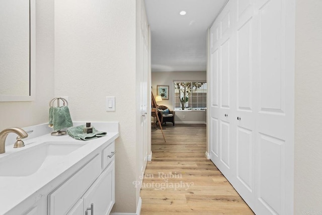 bathroom featuring vanity and hardwood / wood-style floors