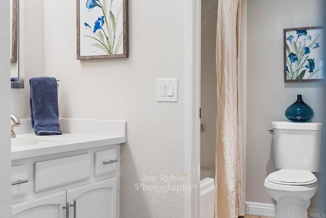 full bathroom featuring vanity, shower / bathtub combination with curtain, and toilet