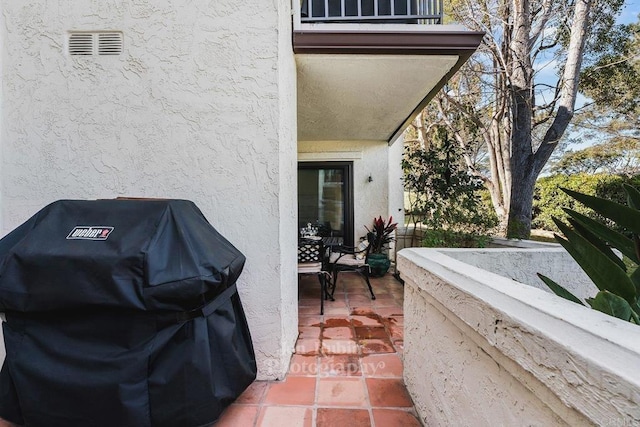 view of patio featuring a grill