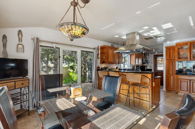 dining area with lofted ceiling