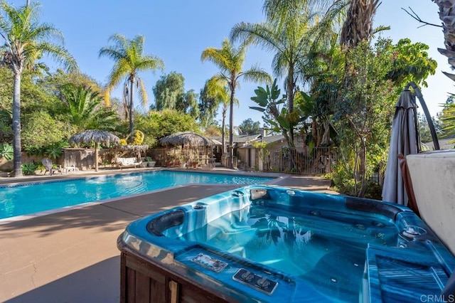 view of pool featuring a hot tub