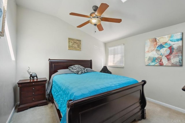 bedroom featuring ceiling fan, light colored carpet, and lofted ceiling