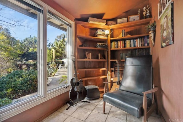 sitting room with plenty of natural light and light tile patterned floors