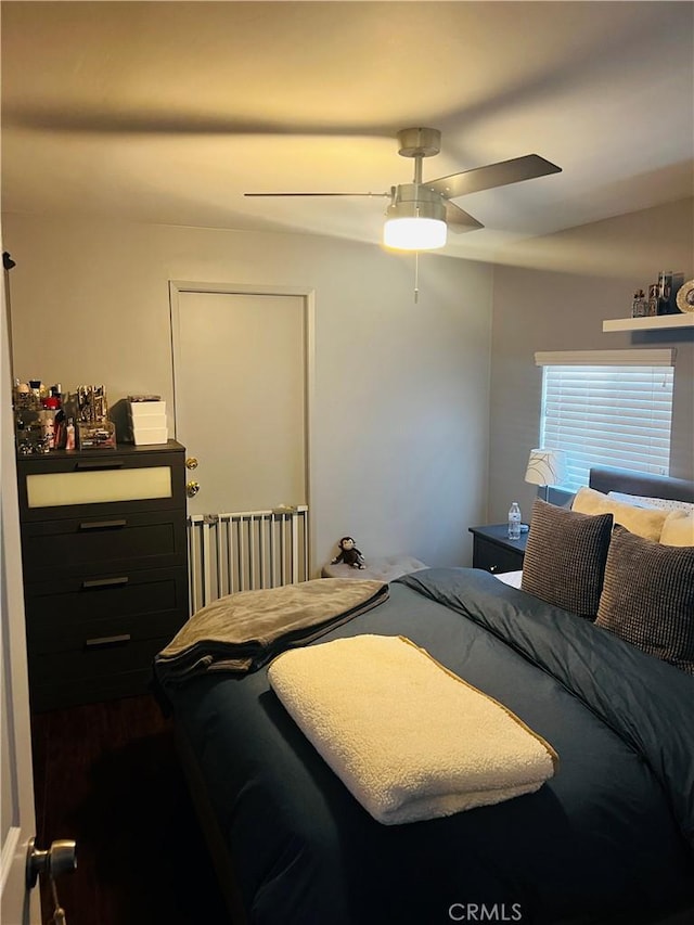 bedroom featuring lofted ceiling and ceiling fan