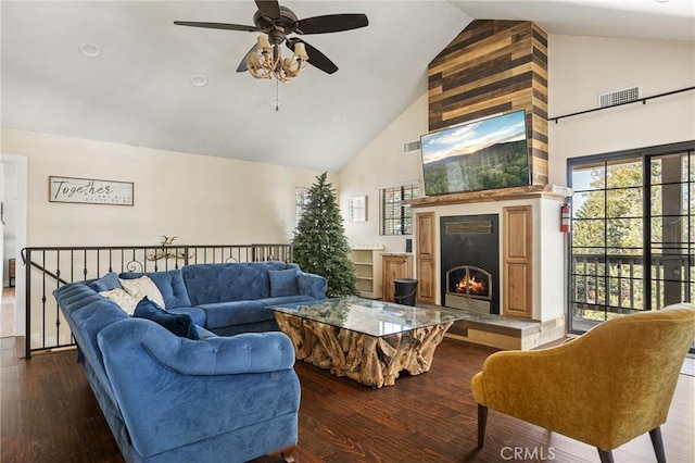 living room featuring a large fireplace, high vaulted ceiling, and dark hardwood / wood-style floors