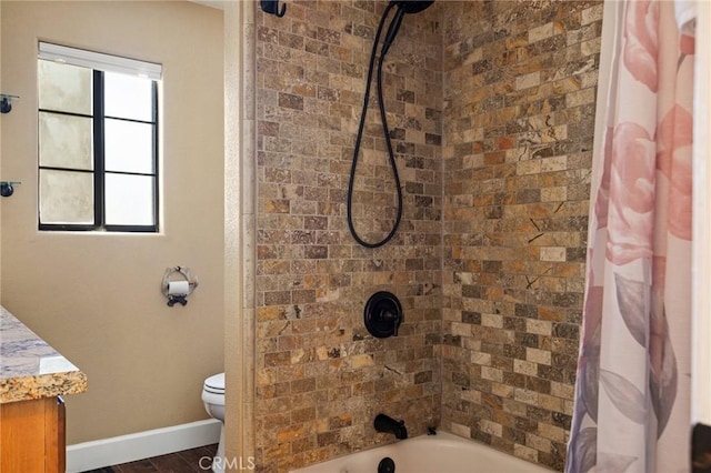 full bathroom featuring vanity, toilet, and shower / tub combo