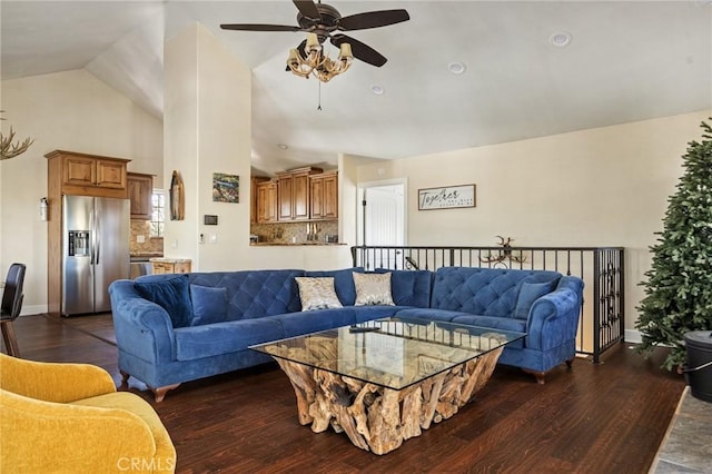 living room featuring dark wood-type flooring and high vaulted ceiling