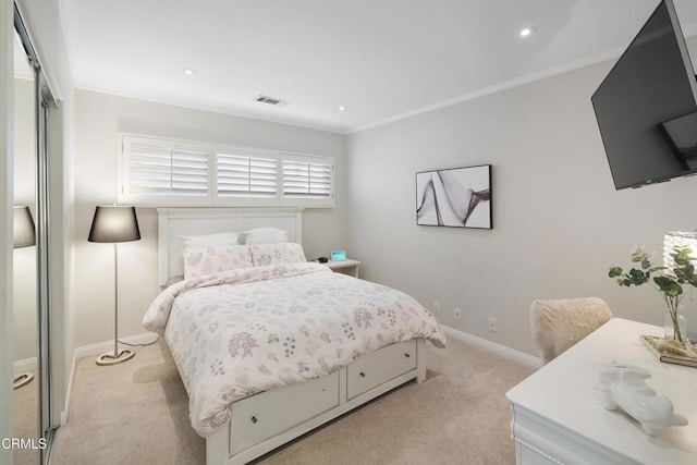 bedroom with light carpet and ornamental molding