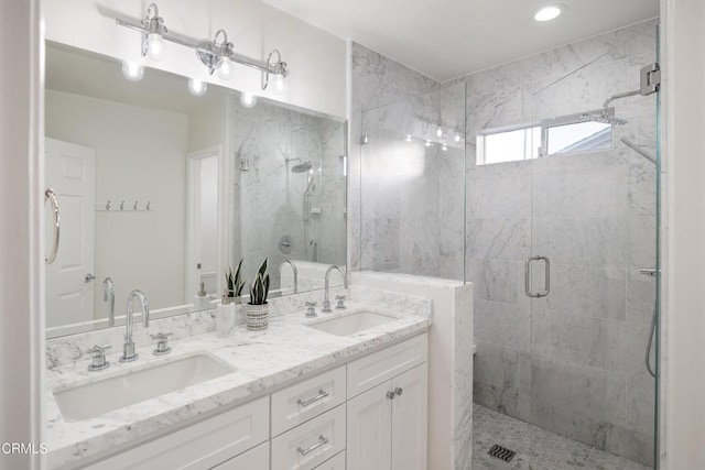 bathroom with vanity and an enclosed shower