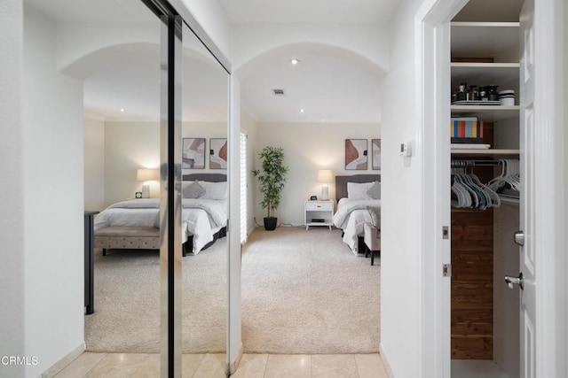 carpeted bedroom with crown molding