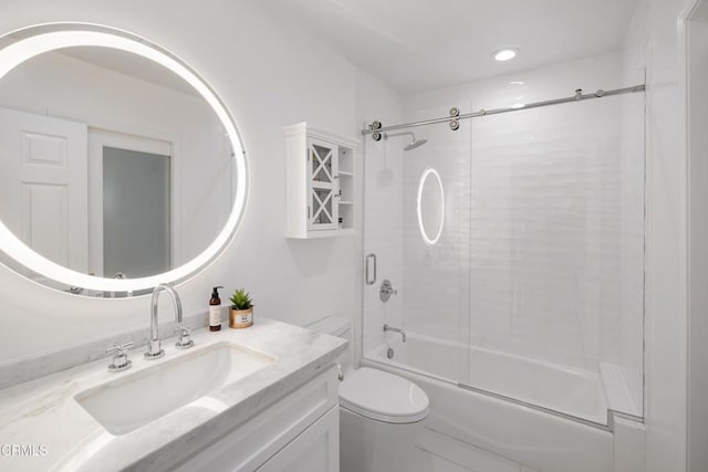 full bathroom featuring bath / shower combo with glass door, vanity, and toilet