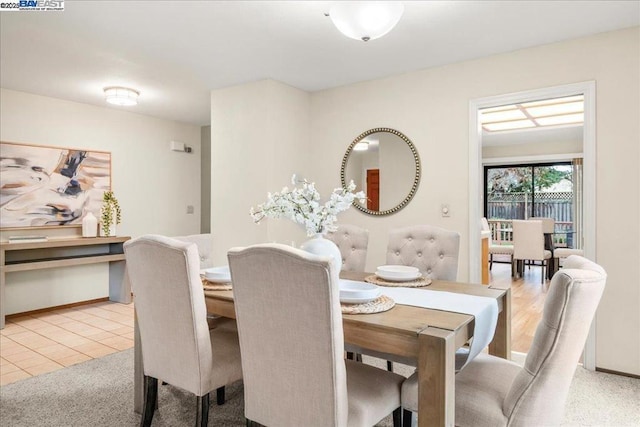 dining room with light tile patterned flooring