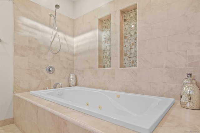 bathroom featuring tile walls and a relaxing tiled tub