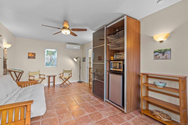 living room featuring a wall mounted air conditioner, tile patterned floors, and ceiling fan