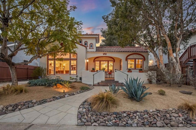 mediterranean / spanish-style home featuring covered porch