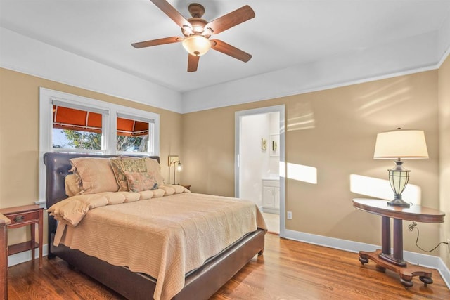 bedroom with wood-type flooring, connected bathroom, and ceiling fan