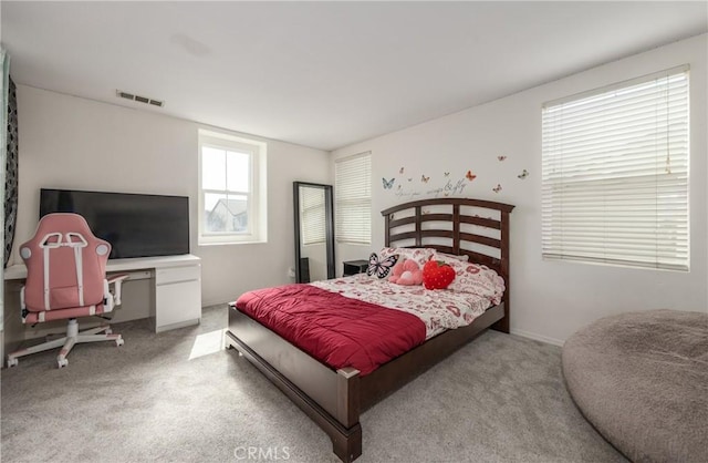 bedroom featuring light carpet