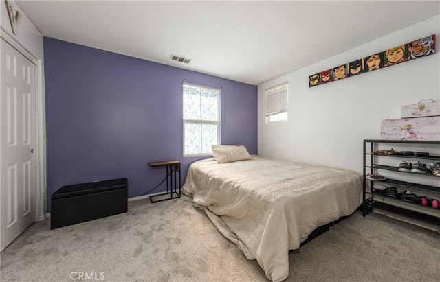 bedroom featuring a closet and carpet