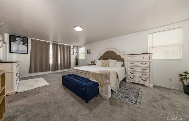 bedroom with carpet flooring and baseboards