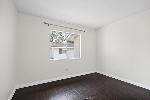 spare room featuring hardwood / wood-style floors