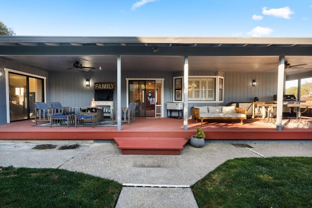 rear view of property with an outdoor hangout area, a deck, and ceiling fan