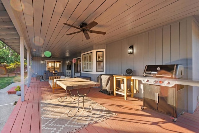 deck with a grill and ceiling fan