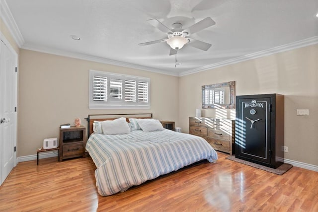 bedroom featuring crown molding, ceiling fan, and light hardwood / wood-style flooring