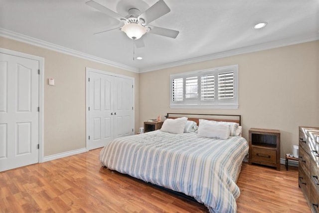 bedroom with crown molding, a closet, and light wood-type flooring