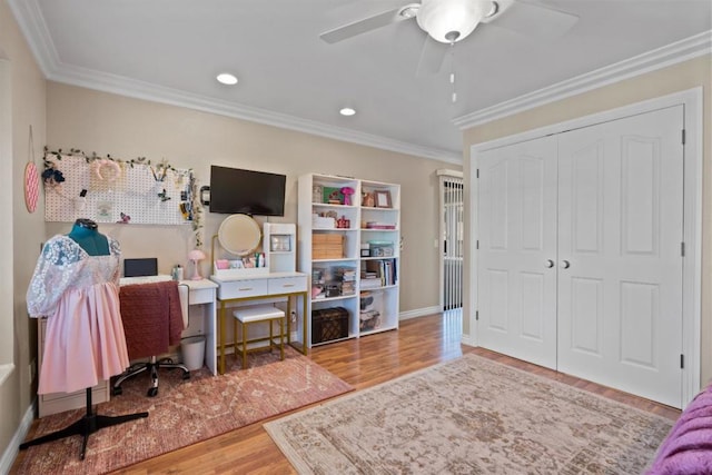 office space with ceiling fan, ornamental molding, and wood-type flooring